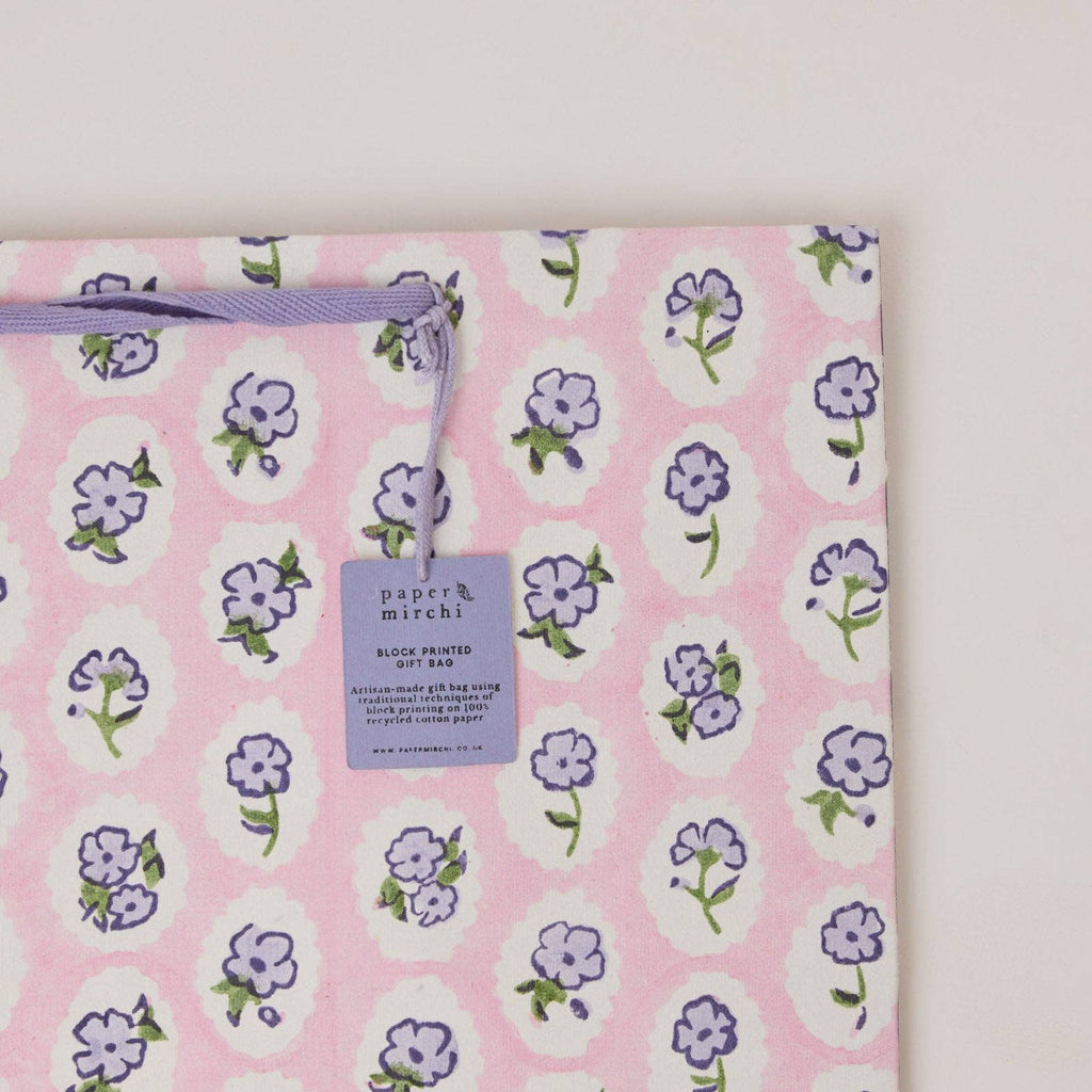 Floral-patterned product on a pink background with 'paper & mirchi' label.