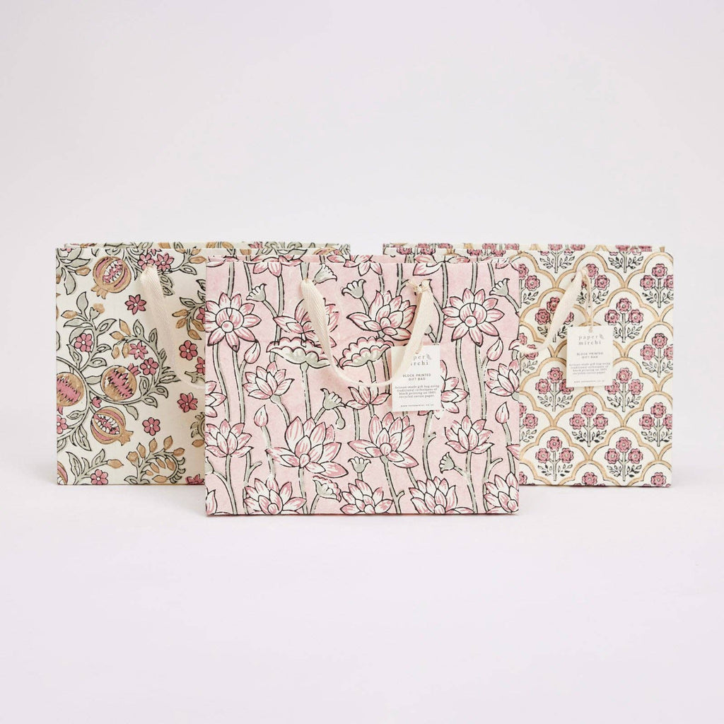 Three floral-patterned products on a white background