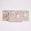 Three floral-patterned products on a white background