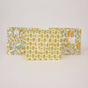 Set of three floral-patterned bags on a light gray background