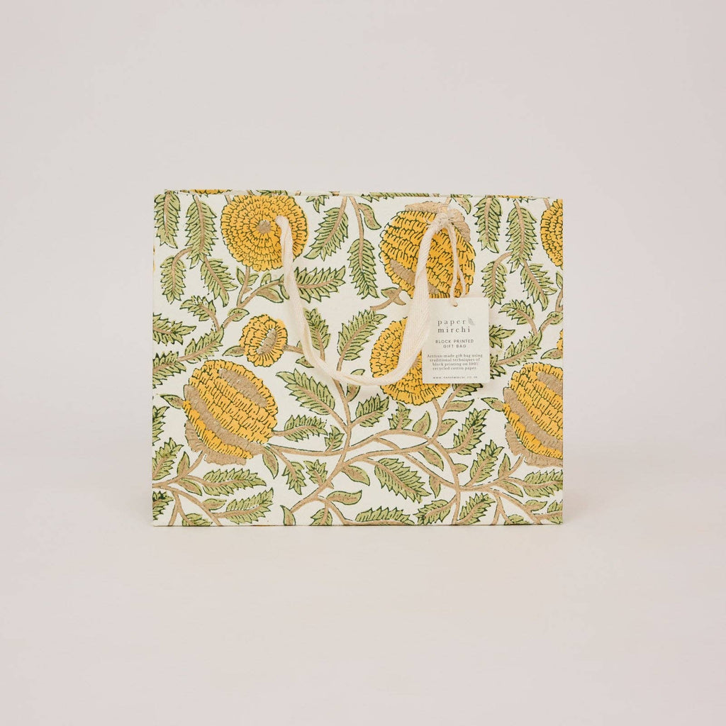 Gift box with corn and leaf pattern on a light beige background