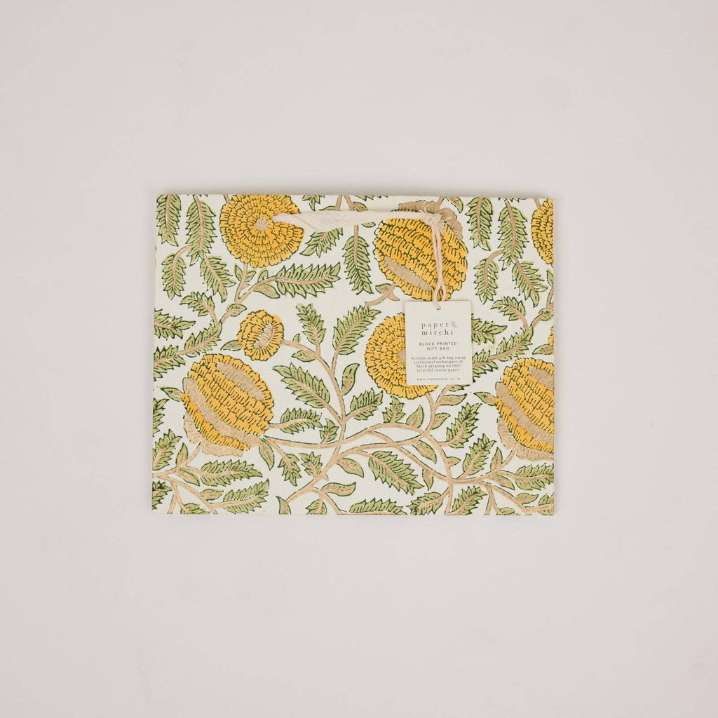 Decorative paper with corn and leaf pattern on a light pink background