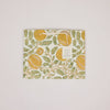 Decorative paper with corn and leaf pattern on a light pink background