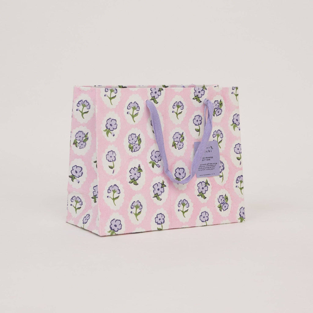 Floral-patterned gift bag on a light gray background