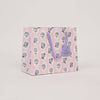 Floral-patterned gift bag on a light gray background