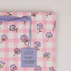 Pink checkered gift bag with floral patterns and a 'Paper Mirchi' label.