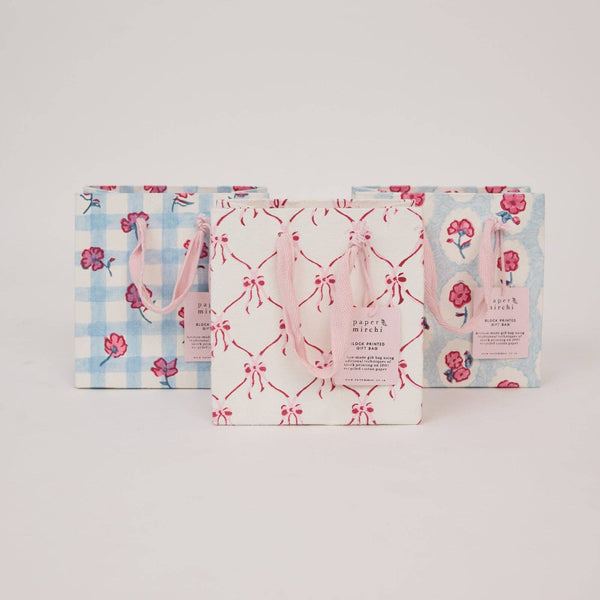 Three patterned bags on a light gray background