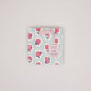 Floral patterned product packaging on a light gray background
