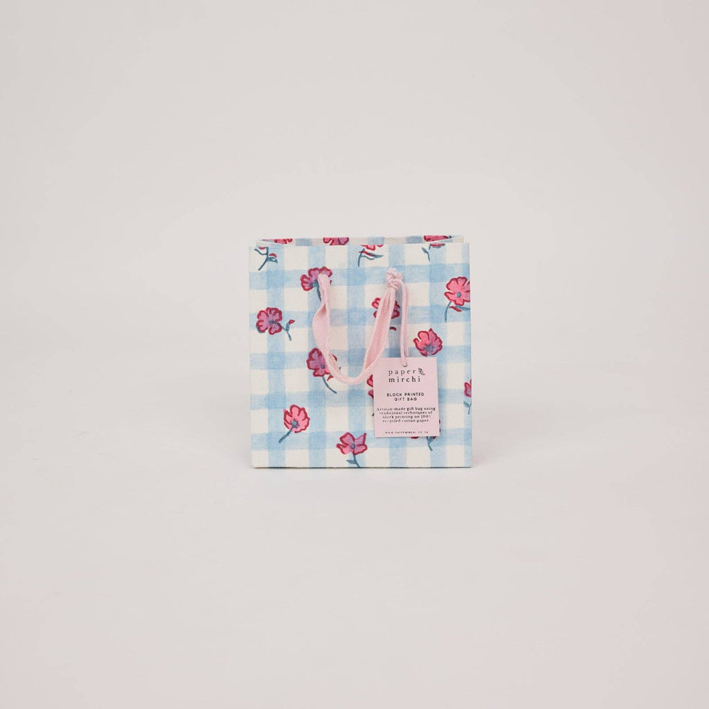 Floral patterned product packaging on a light gray background