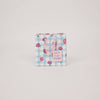Floral patterned product packaging on a light gray background