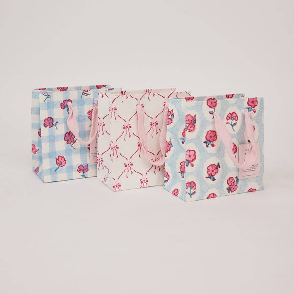 Three patterned bags on a light gray background