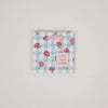 Floral and checkered patterned product on a gray background
