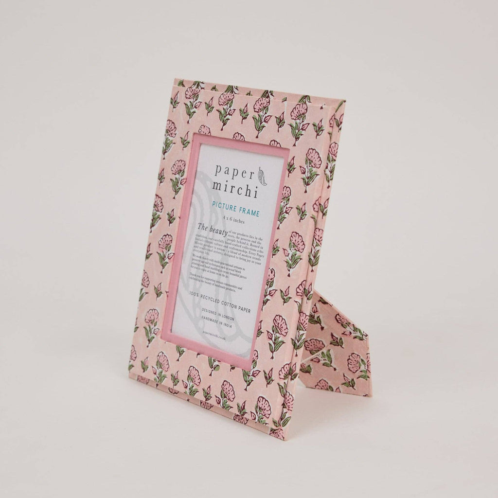 Floral patterned picture frame with 'paper mirchi' branding on a light gray background