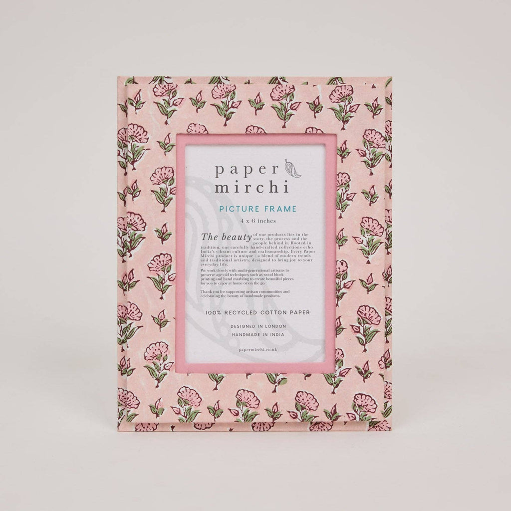 Floral patterned picture frame with 'paper mirchi' branding on a light pink background