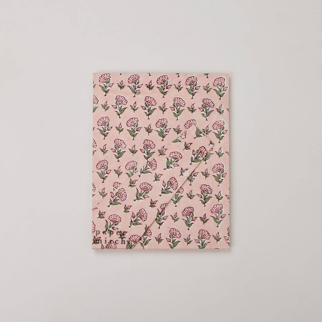 Floral patterned notebook on a light gray background