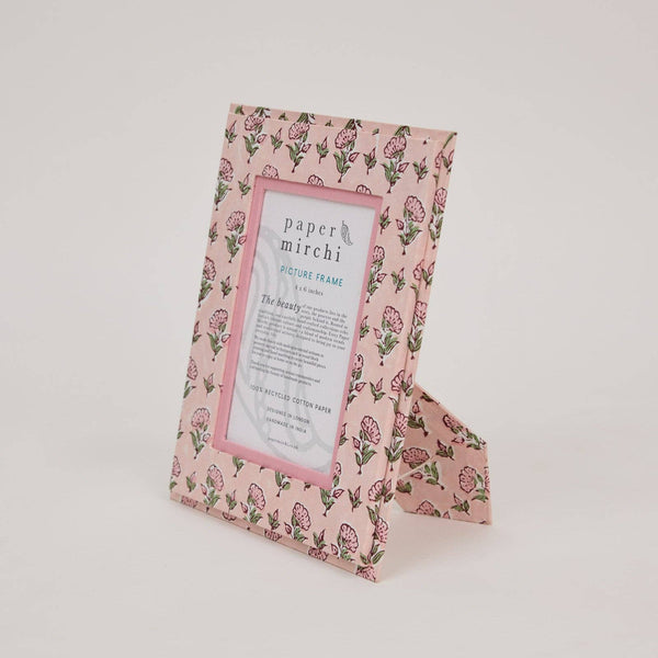 Floral patterned picture frame with 'paper mirchi' branding on a light gray background