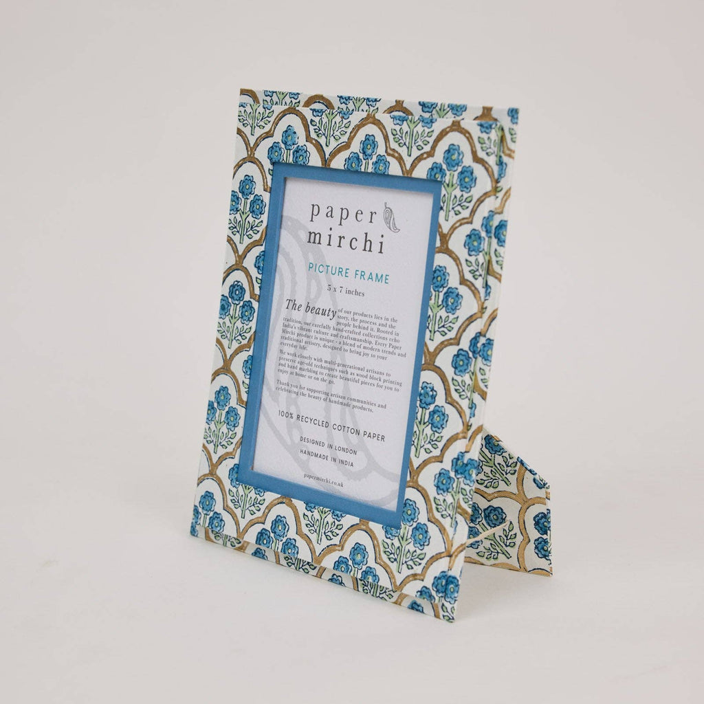 Decorative picture frame with floral pattern on a white background