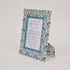 Decorative picture frame with floral pattern on a white background