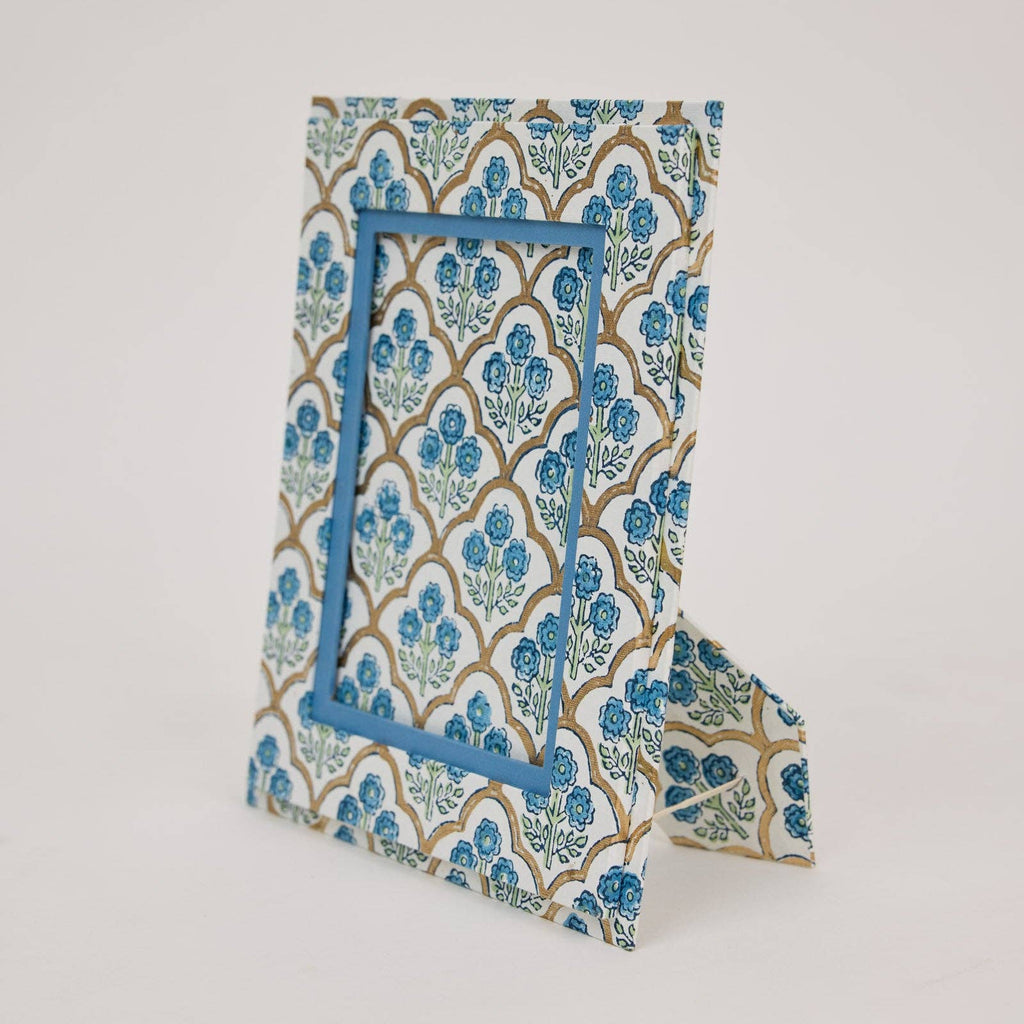 Decorative blue and white patterned box on a light gray background