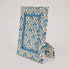 Decorative blue and white patterned box on a light gray background