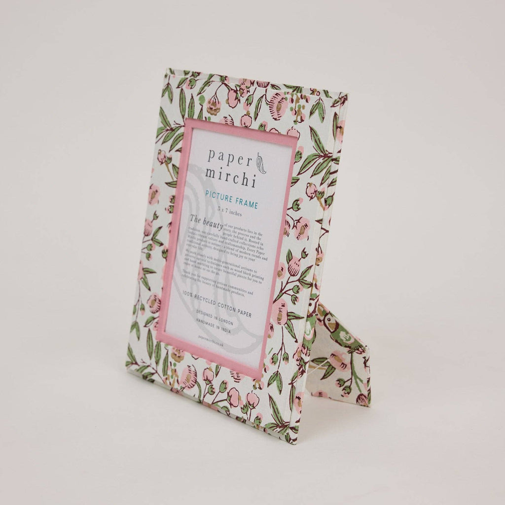 Floral patterned picture frame with 'paper mirchi' branding on a white background