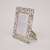 Floral patterned picture frame with 'paper mirchi' branding on a white background