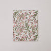 Floral patterned notebook on a light gray background