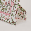 Floral-patterned product with pink accents on a white background