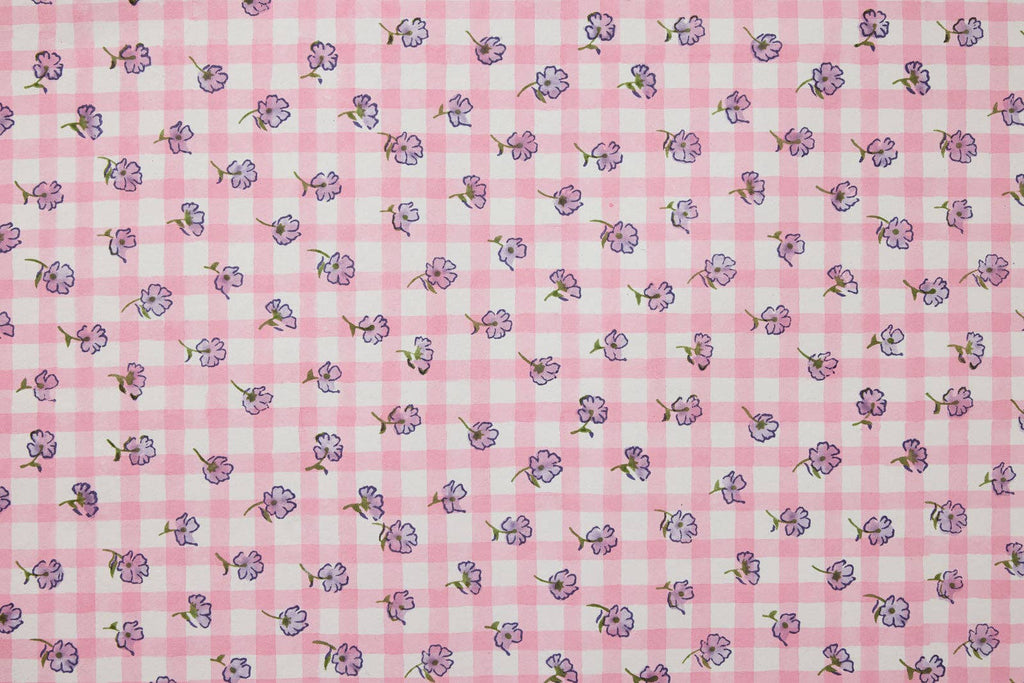 Pink checkered fabric with small floral patterns
