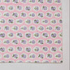Fabric with small floral pattern on a pink background