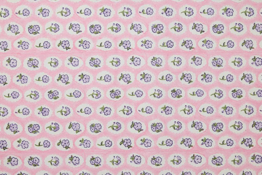 Small floral pattern on a pink background