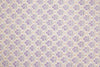 Patterned fabric with purple and beige design