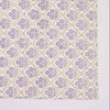 Patterned fabric with purple floral design on a white background