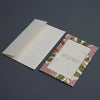 Floral greeting card with envelope on a dark background
