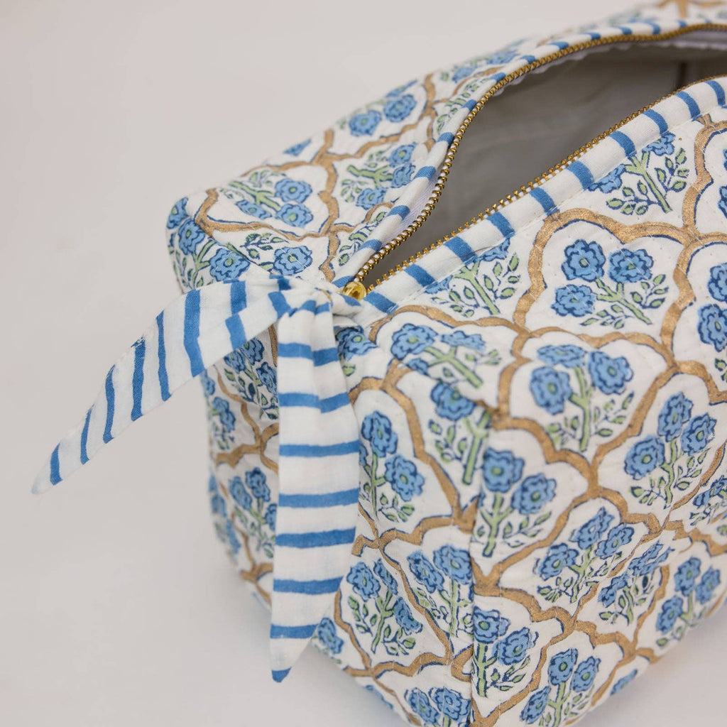Floral patterned pouch with blue accents on a white background