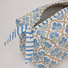 Floral patterned pouch with blue accents on a white background