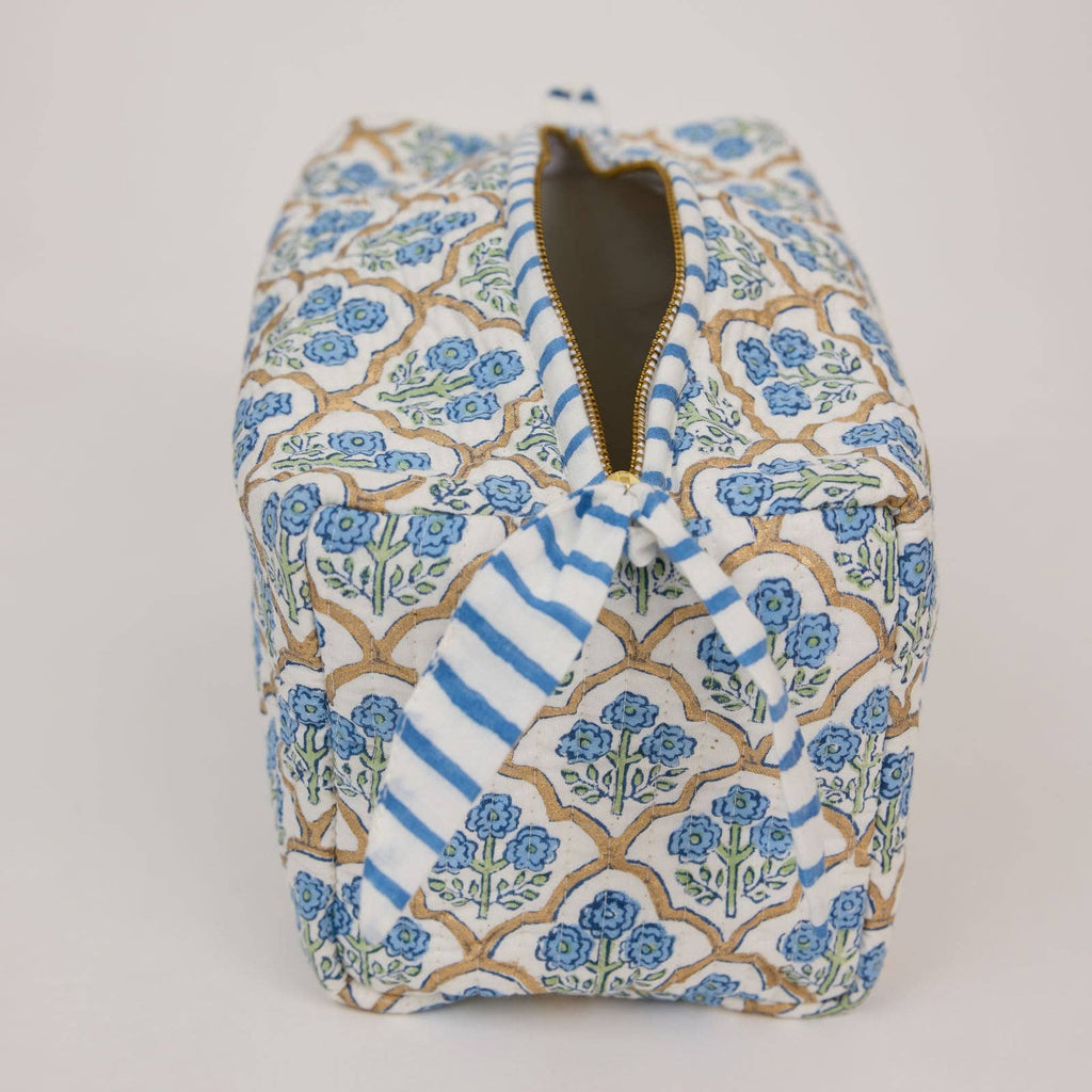 Fabric pouch with blue floral pattern on a white background