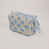 Fabric pouch with blue floral and striped pattern on a light gray background