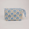 Fabric pouch with blue floral pattern on a light gray background