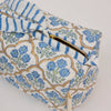 Rectangular fabric pouch with floral pattern and blue stripes on a white background