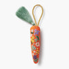 Decorative carrot-shaped keychain with floral embroidery on a white background