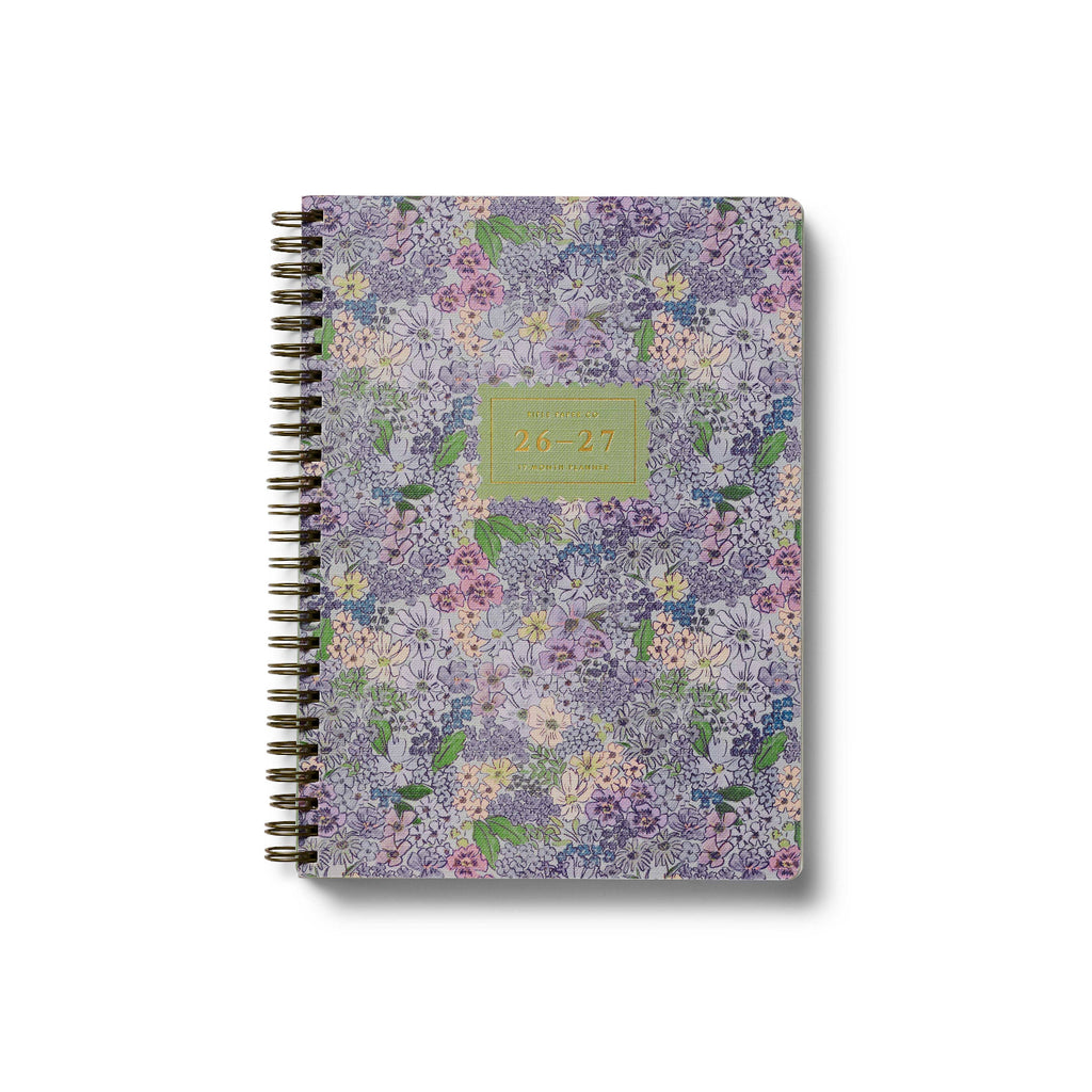 Floral patterned notebook with a green label on a white background