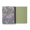 Notebook with floral cover and green back cover on a white background
