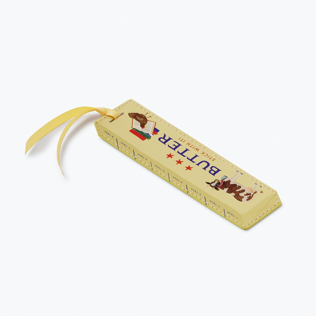 Butter bar with a yellow wrapper on a white background