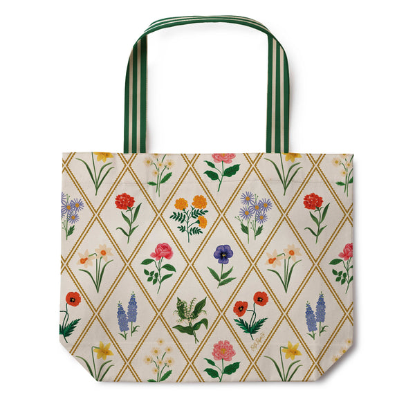 Tote bag with floral pattern and green handles on a white background