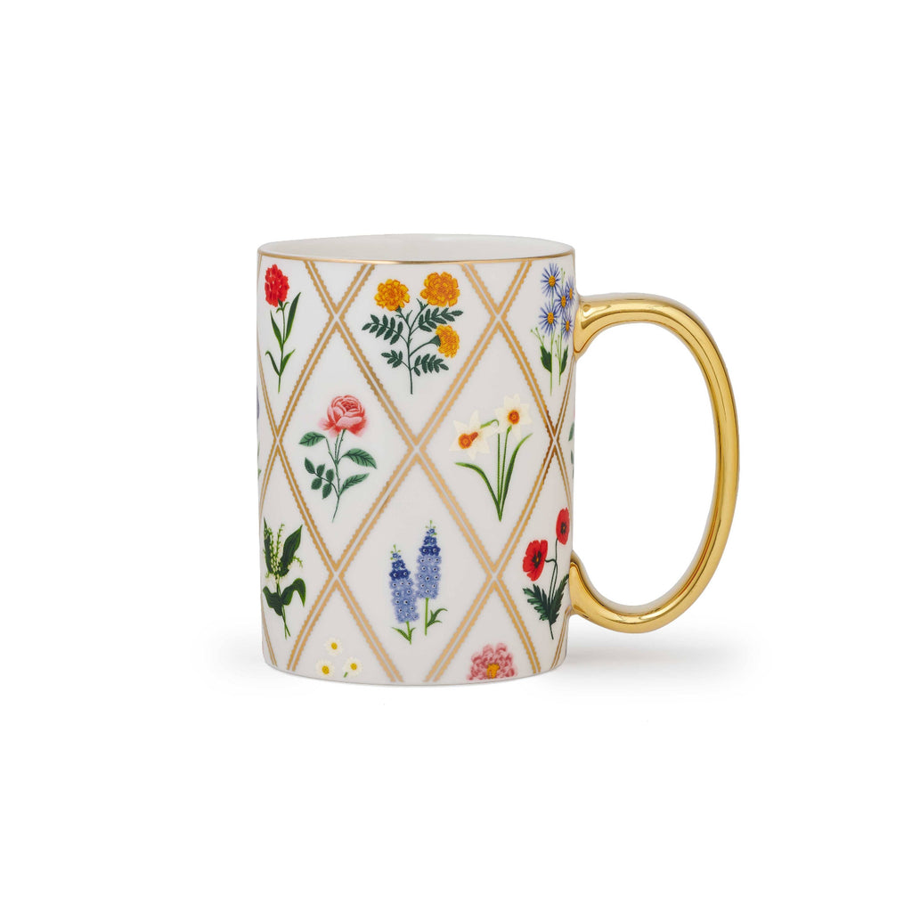 Mug with floral pattern and gold handle on a white background