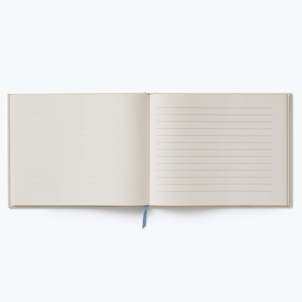 Open notebook with lined pages on a white background