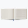 Open notebook with lined pages on a white background