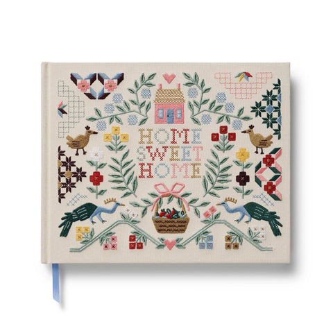 Decorative notebook with floral and text design on a white background