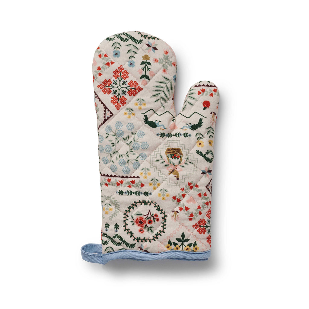 Decorative oven mitt with floral and geometric patterns on a white background